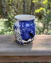 Load image into Gallery viewer, Blue and white ceramic mug on a wooden surface with a natural background

